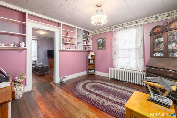 a bedroom with furniture and a window