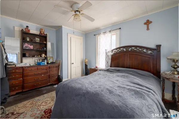a bedroom with a bed and a dresser