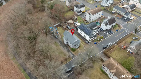 an aerial view of residential houses with outdoor space