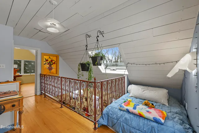 a bedroom with furniture and a baby crib