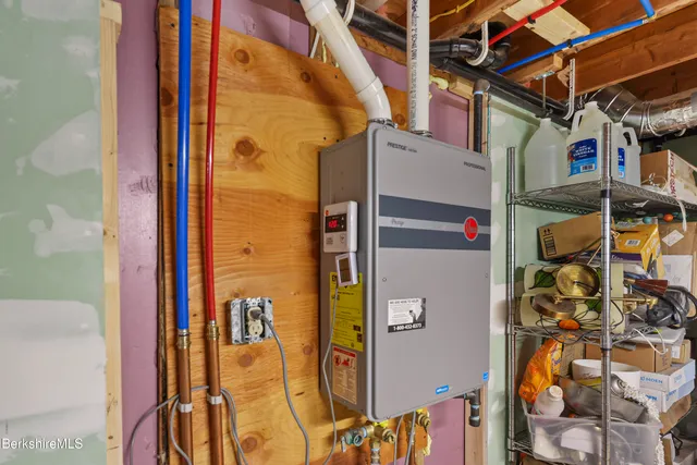 view of hall way with mirror and windows