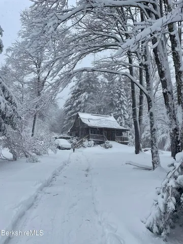 a view of snow on the side of the road