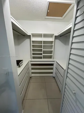 a view of an empty walk in closet