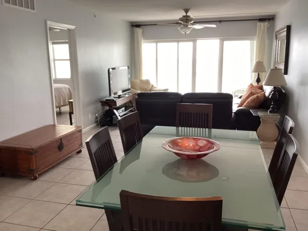 a living room with furniture and a lamp