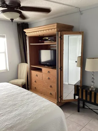 a bedroom with a bed and a dresser