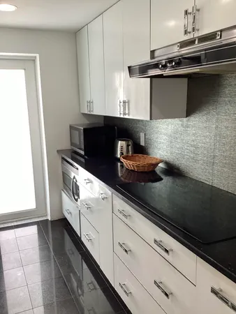 a close view of stove and microwave