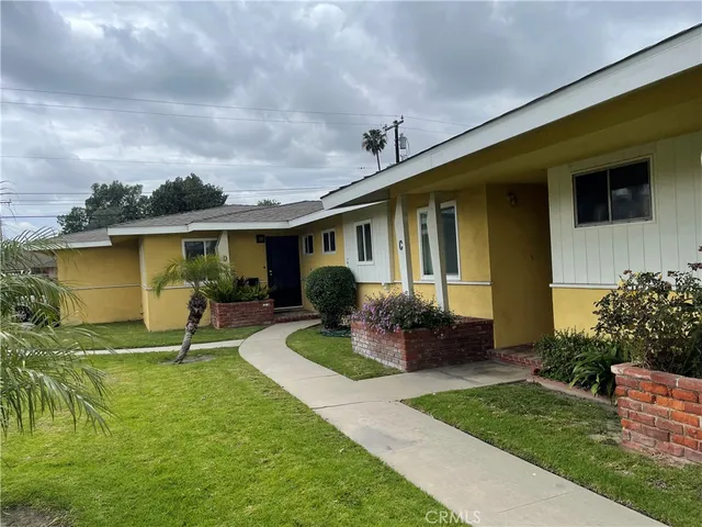 a house view with a garden space