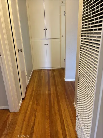 an empty room with wooden floor