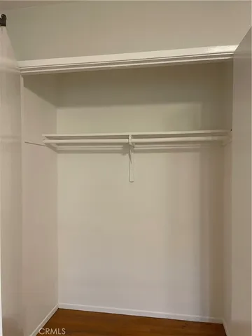 a white toilet and tub sitting next to a bathroom sink