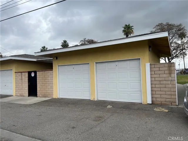 a house view with swimming pool and garden
