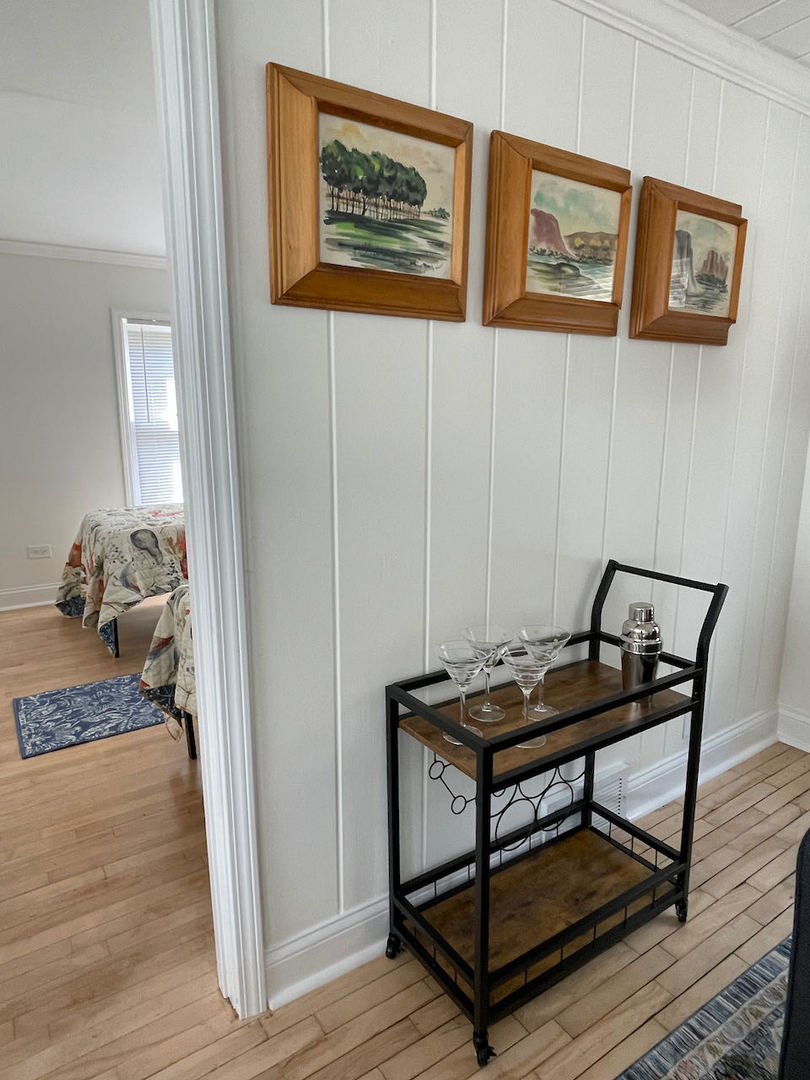 521 Peyton Street, Unit 100 Geneva, IL 60134 - Photo 12 of 34 a view of a hallway with furniture and wooden floor