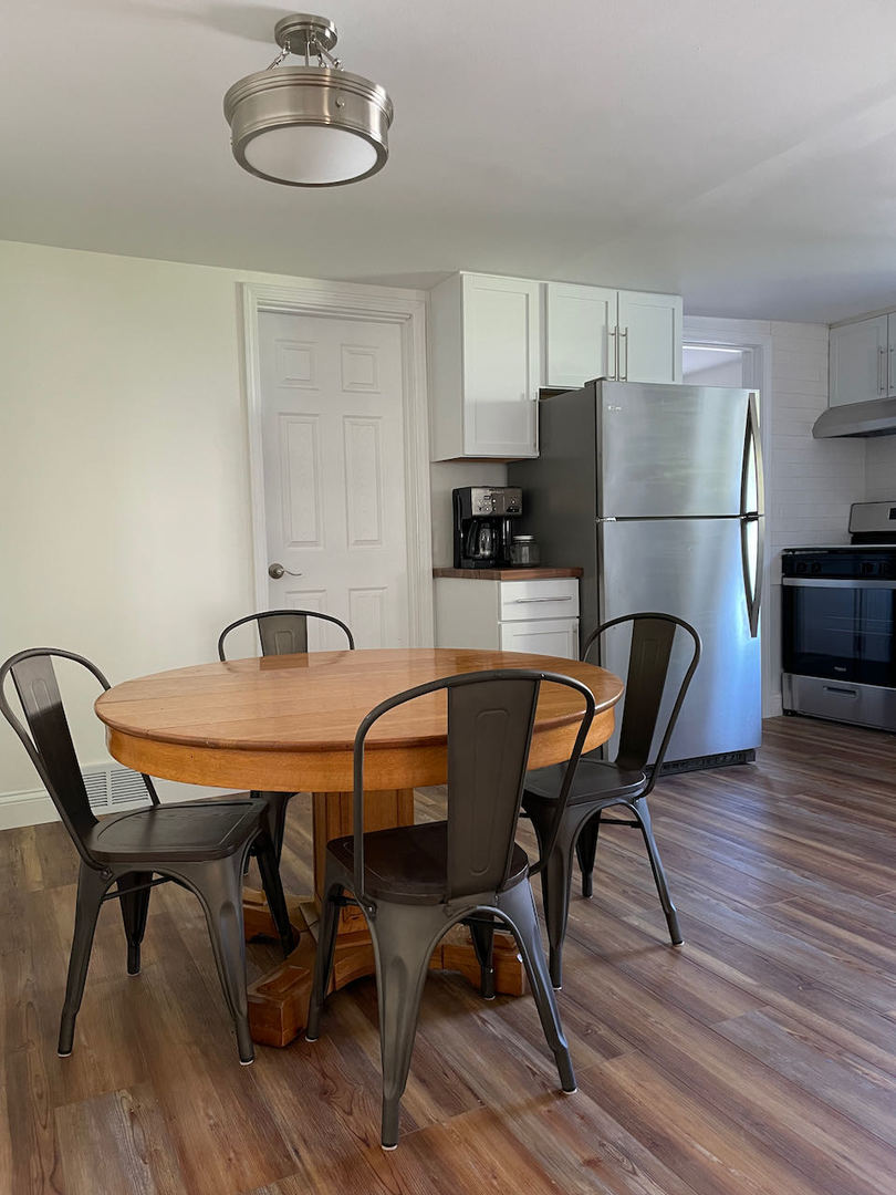 521 Peyton Street, Unit 100 Geneva, IL 60134 - Photo 16 of 34 a view of a dining room with furniture and wooden floor