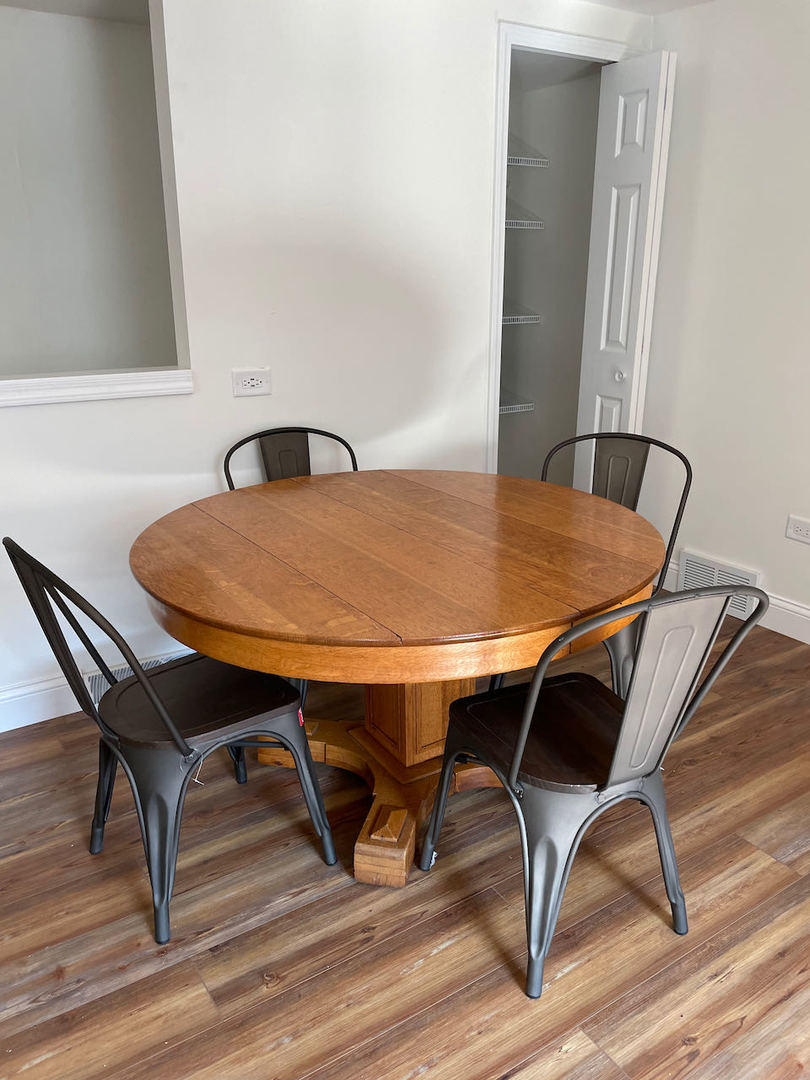 521 Peyton Street, Unit 100 Geneva, IL 60134 - Photo 17 of 34 a view of a dining room with furniture and wooden floor