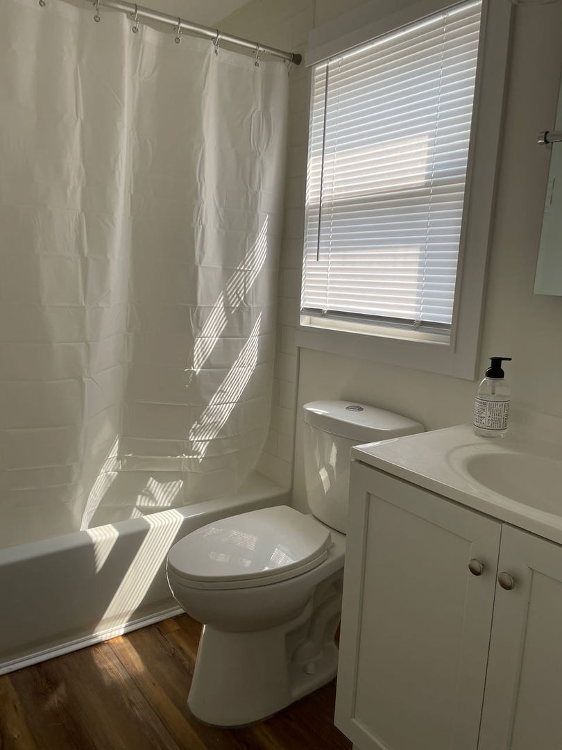 521 Peyton Street, Unit 100 Geneva, IL 60134 - Photo 24 of 34 a bathroom with a sink and a mirror