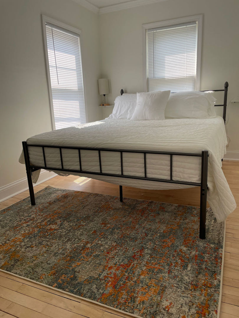 521 Peyton Street, Unit 100 Geneva, IL 60134 - Photo 27 of 34 a bedroom with a bed and a window