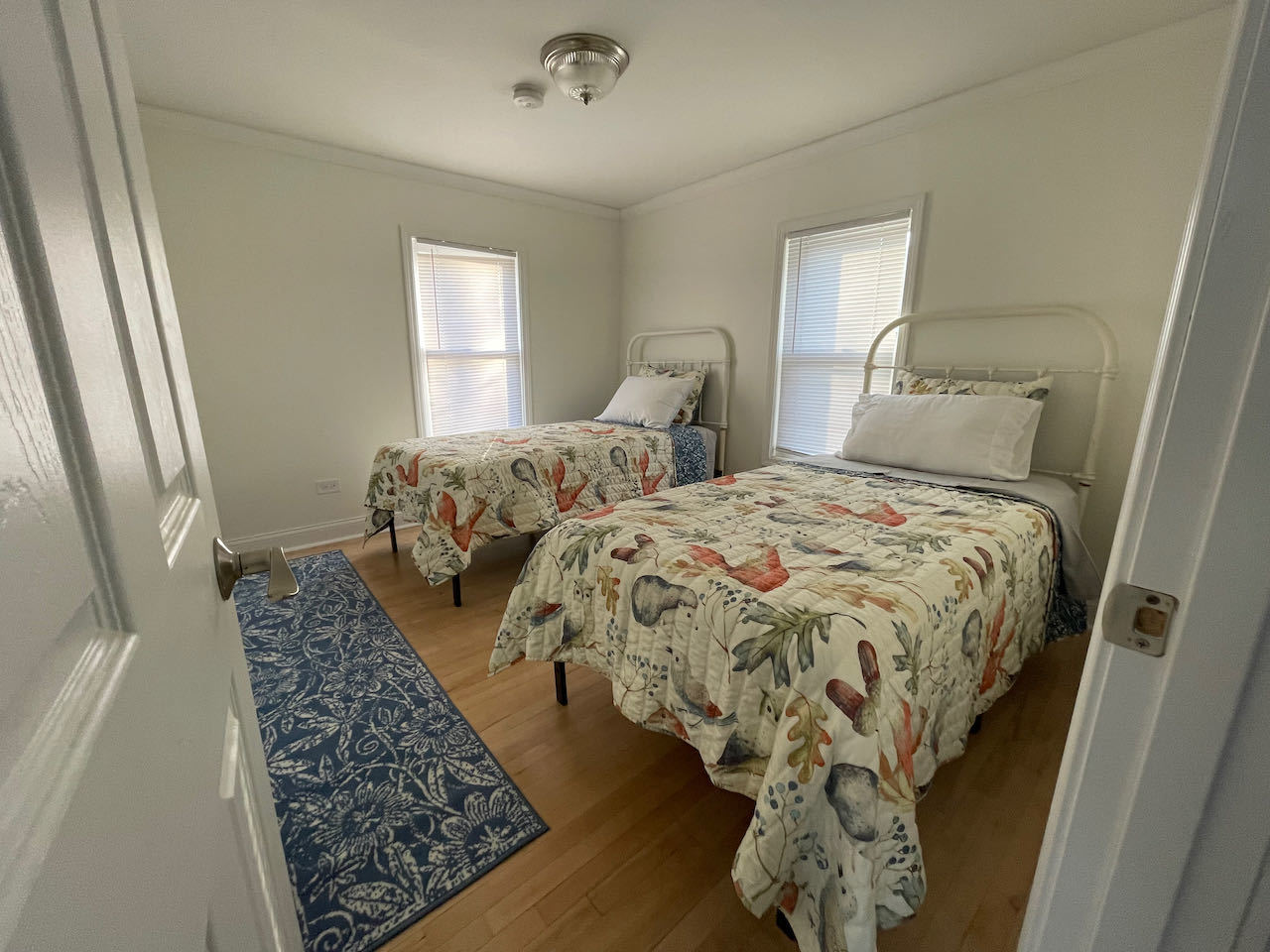 521 Peyton Street, Unit 100 Geneva, IL 60134 - Photo 30 of 34 a bed sitting in a bedroom next to a window