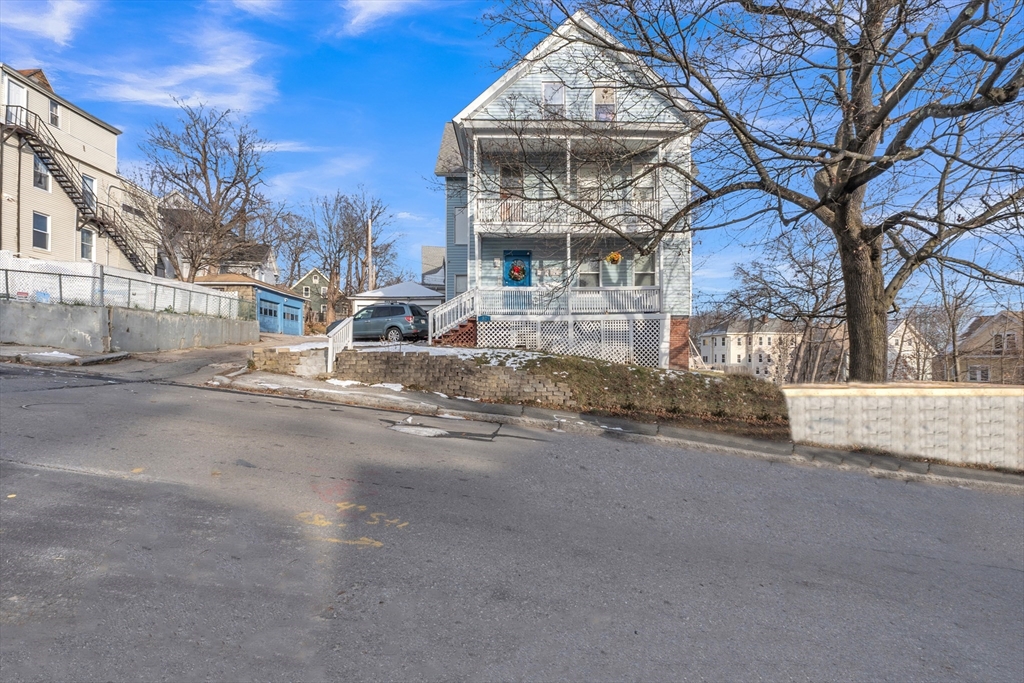 31 Ripley Street, Unit 3 Worcester, MA 01610 - Photo 1 of 29 a large building with a street