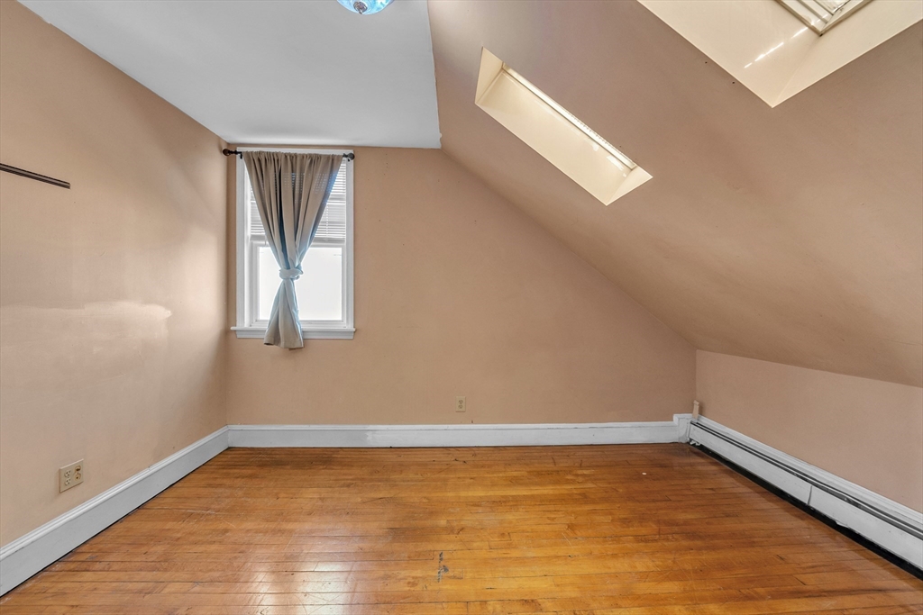 31 Ripley Street, Unit 3 Worcester, MA 01610 - Photo 16 of 29 a view of a room with wooden floor and cabinet