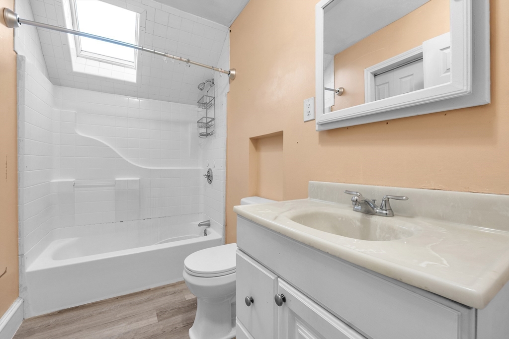 31 Ripley Street, Unit 3 Worcester, MA 01610 - Photo 18 of 29 a bathroom with a sink a toilet and shower