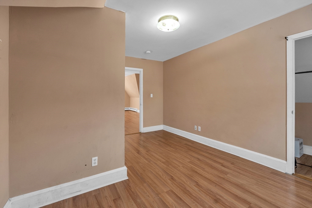 31 Ripley Street, Unit 3 Worcester, MA 01610 - Photo 26 of 29 a view of an empty room with wooden floor