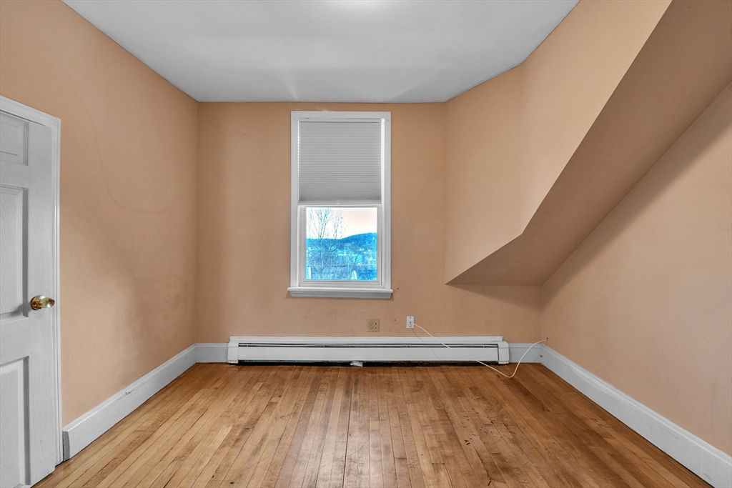 31 Ripley Street, Unit 3 Worcester, MA 01610 - Photo 27 of 29 a view of a room with wooden floor and window