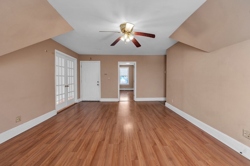 31 Ripley Street, Unit 3 Worcester, MA 01610 - Photo 3 of 29 a view of empty room with wooden floor and fan