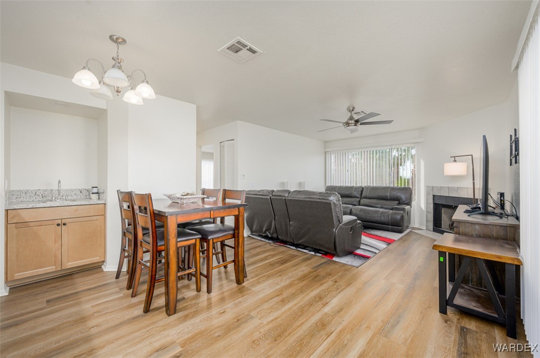 2004 Mesquite Lane, Unit 304 Laughlin, NV 89029 - Photo 11 of 36 a kitchen with a table chairs stove and cabinets