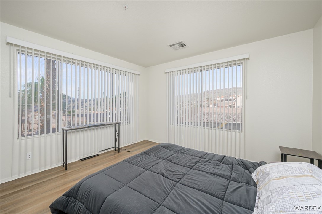 2004 Mesquite Lane, Unit 304 Laughlin, NV 89029 - Photo 21 of 36 a bedroom with a bed and a window