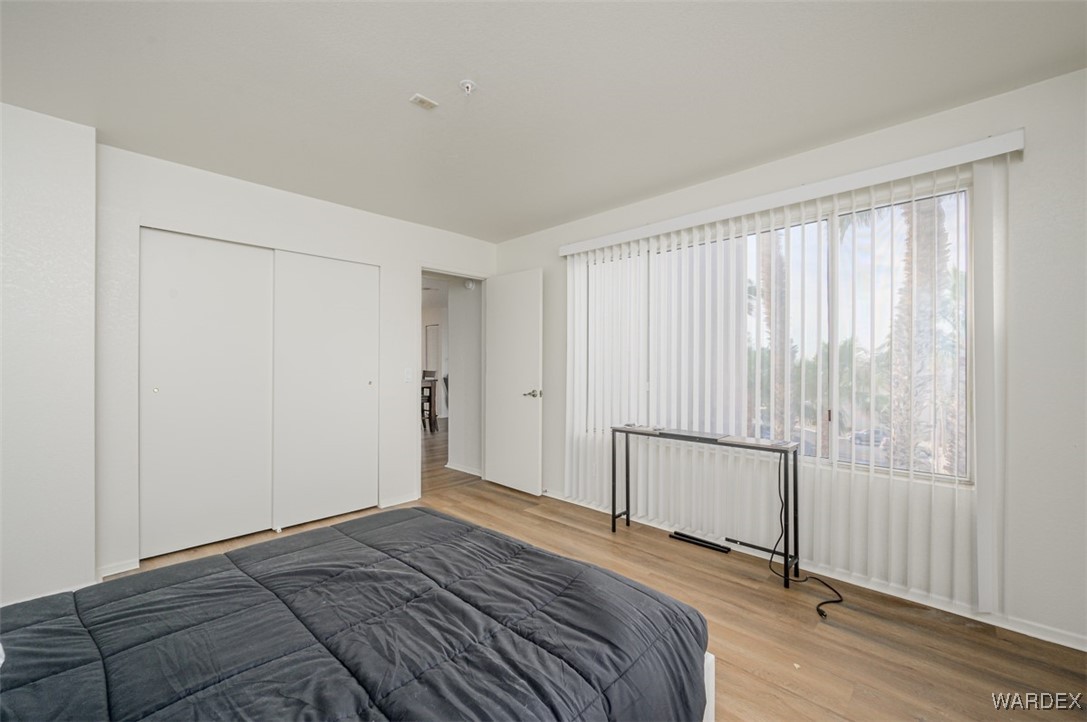 2004 Mesquite Lane, Unit 304 Laughlin, NV 89029 - Photo 23 of 36 a view of bedroom with wooden floor