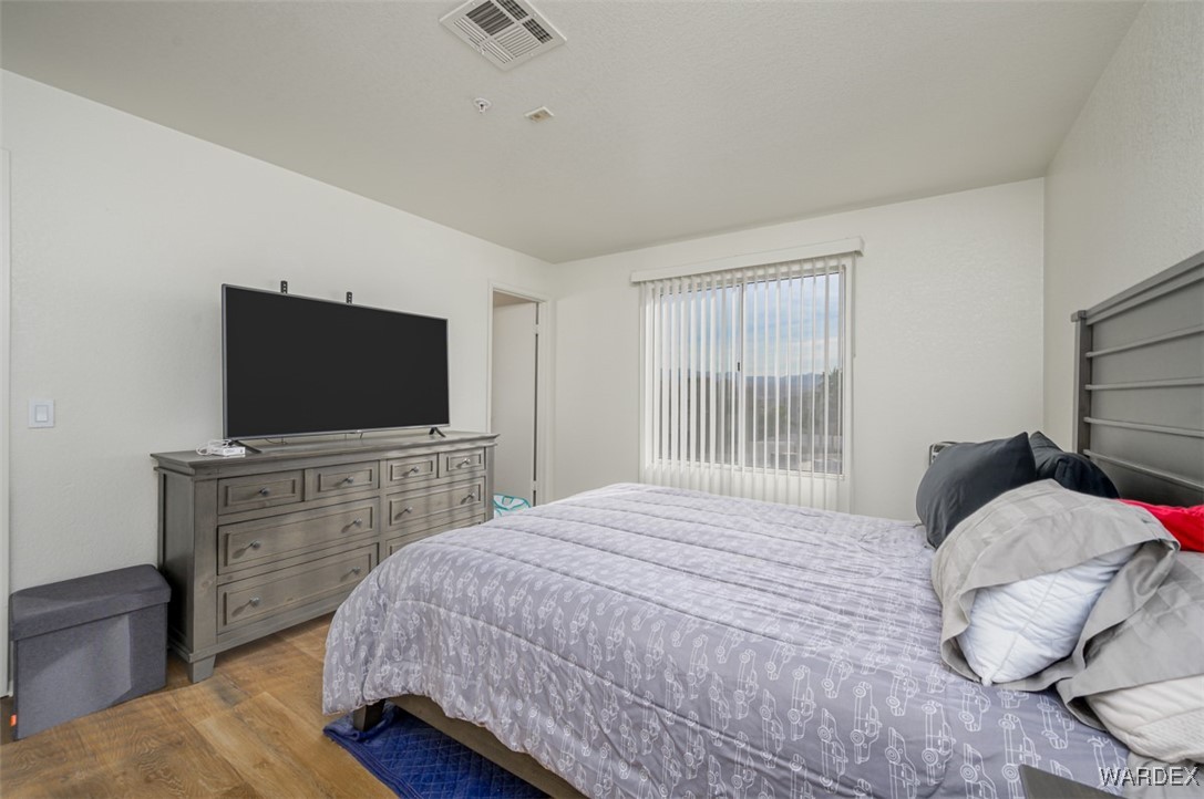 2004 Mesquite Lane, Unit 304 Laughlin, NV 89029 - Photo 26 of 36 a bedroom with a bed and a flat screen tv