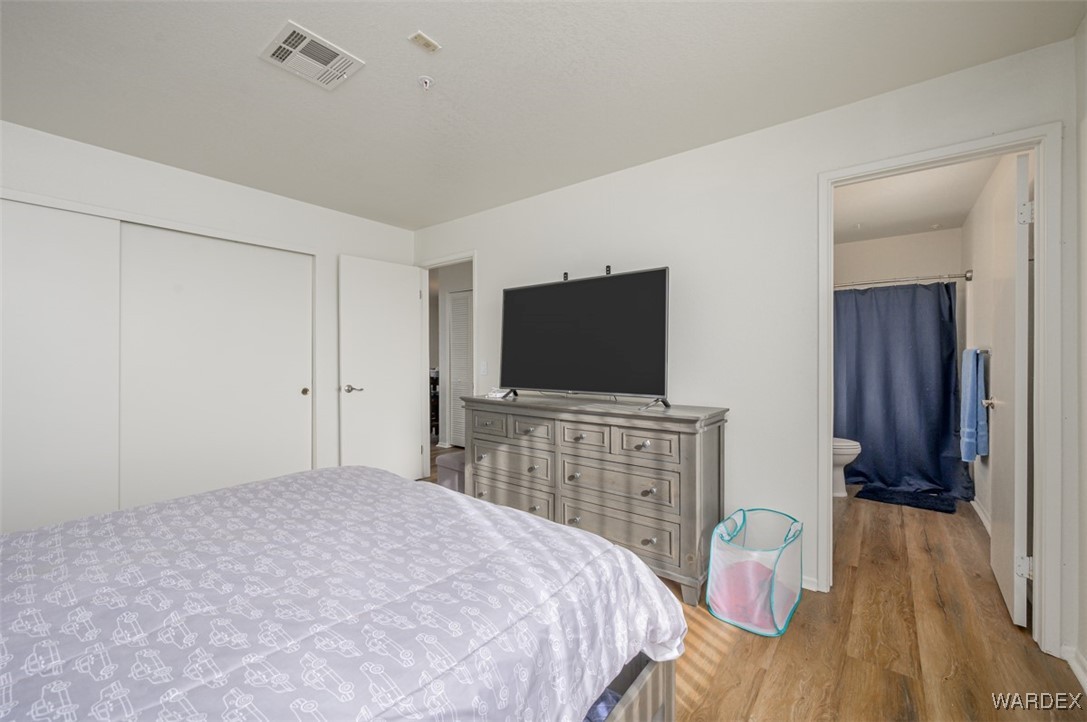 2004 Mesquite Lane, Unit 304 Laughlin, NV 89029 - Photo 27 of 36 a bedroom with a bed and a flat screen tv