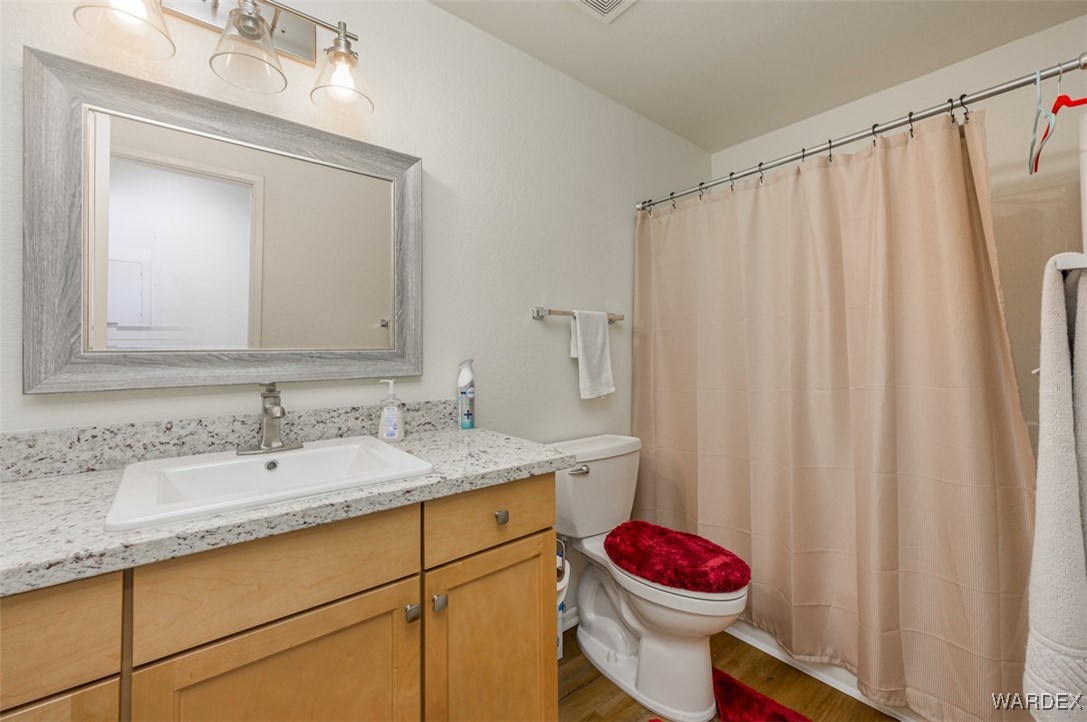 2004 Mesquite Lane, Unit 304 Laughlin, NV 89029 - Photo 30 of 36 a bathroom with a sink and a mirror