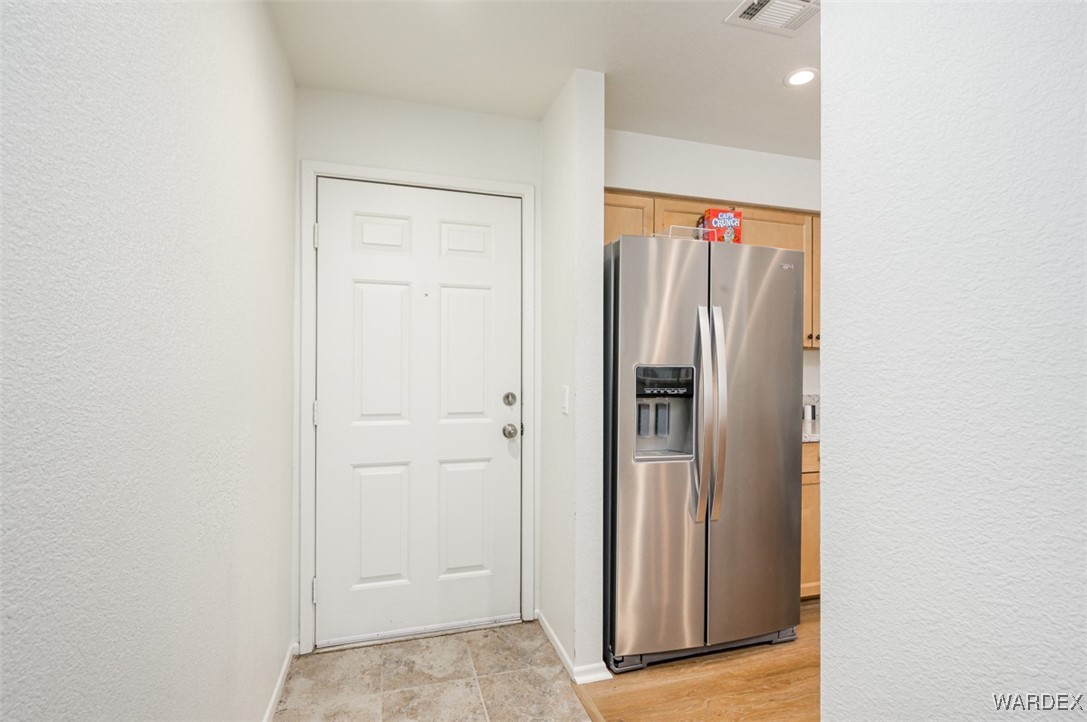 2004 Mesquite Lane, Unit 304 Laughlin, NV 89029 - Photo 3 of 36 a view of a kitchen with wooden floor and closet