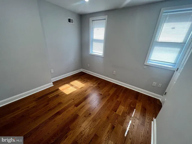 a bathroom with a glass door shower