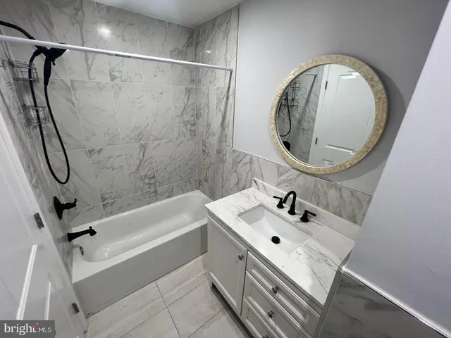 a white toilet sitting next to a bathroom sink