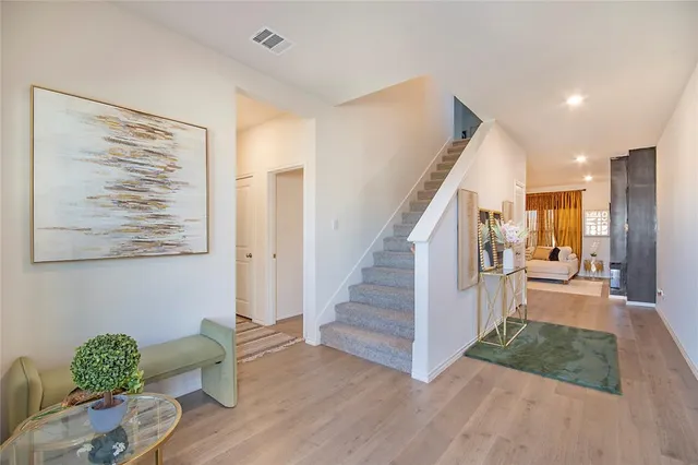 a view of entryway and livingroom with wooden floor