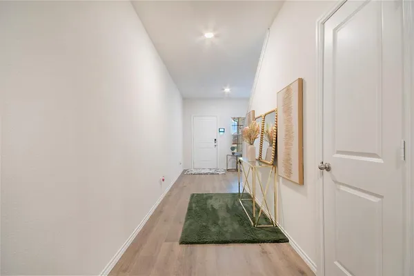 a view of a hallway with a white walls