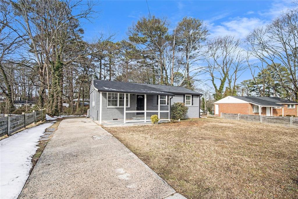 front view of a house with a trees