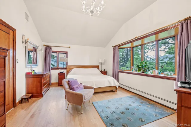 a bed room with a bed and a large window