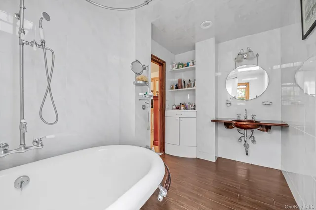 a bathroom with a bathtub and a shower