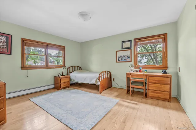 a bedroom with furniture and a window