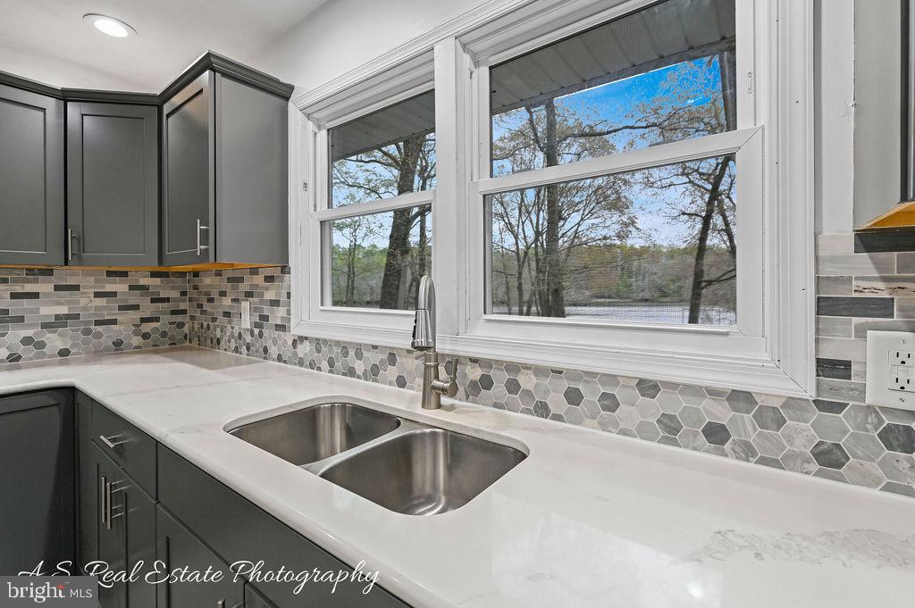 30833 Dogwood Drive Laurel, DE 19956 - Photo 12 of 27 a bathroom with a sink and a window
