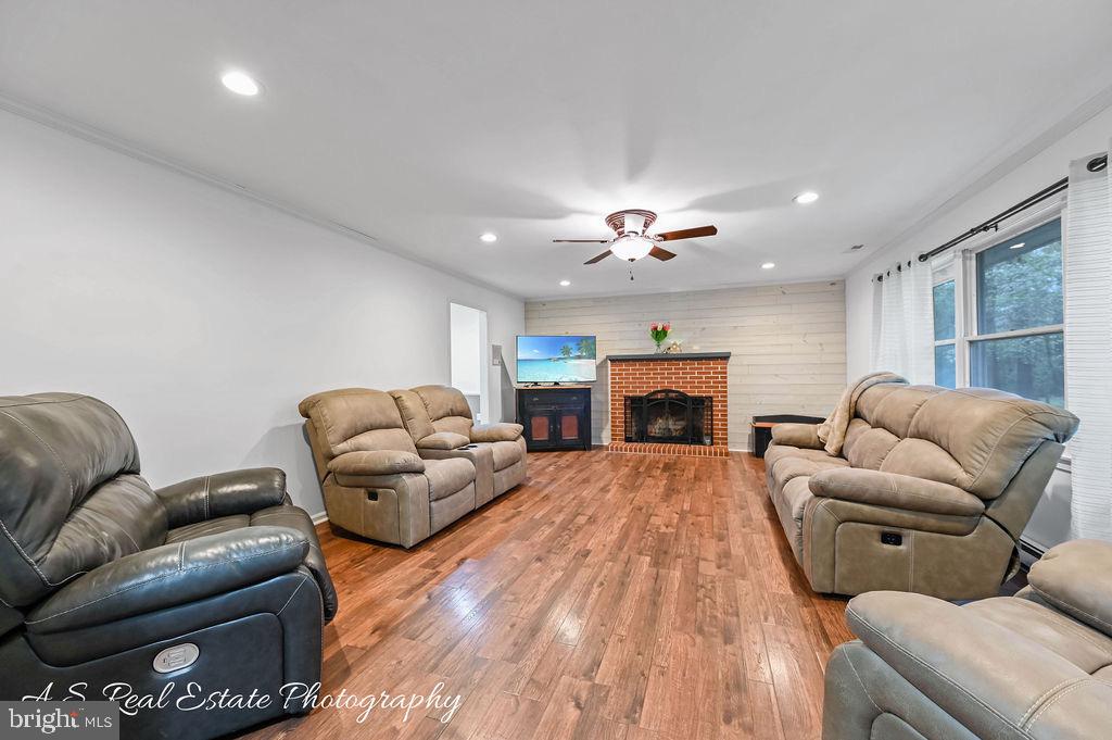 30833 Dogwood Drive Laurel, DE 19956 - Photo 14 of 27 a living room with furniture a fireplace and a fireplace