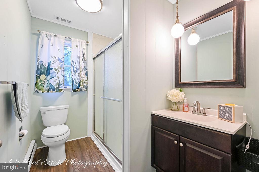 30833 Dogwood Drive Laurel, DE 19956 - Photo 20 of 27 a bathroom with a toilet sink and mirror