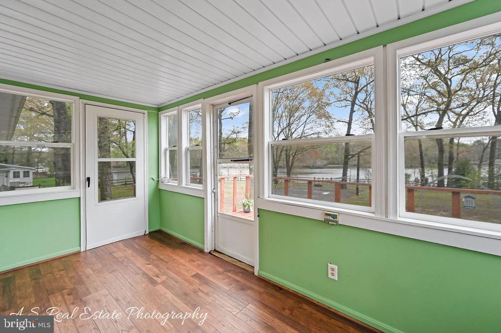 30833 Dogwood Drive Laurel, DE 19956 - Photo 21 of 27 a room with window wooden floor and outdoor view
