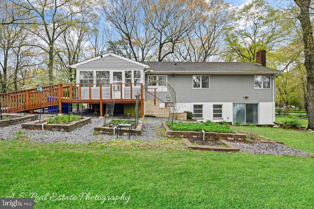 30833 Dogwood Drive Laurel, DE 19956 - Photo 22 of 27 a front view of a house with garden and sitting area