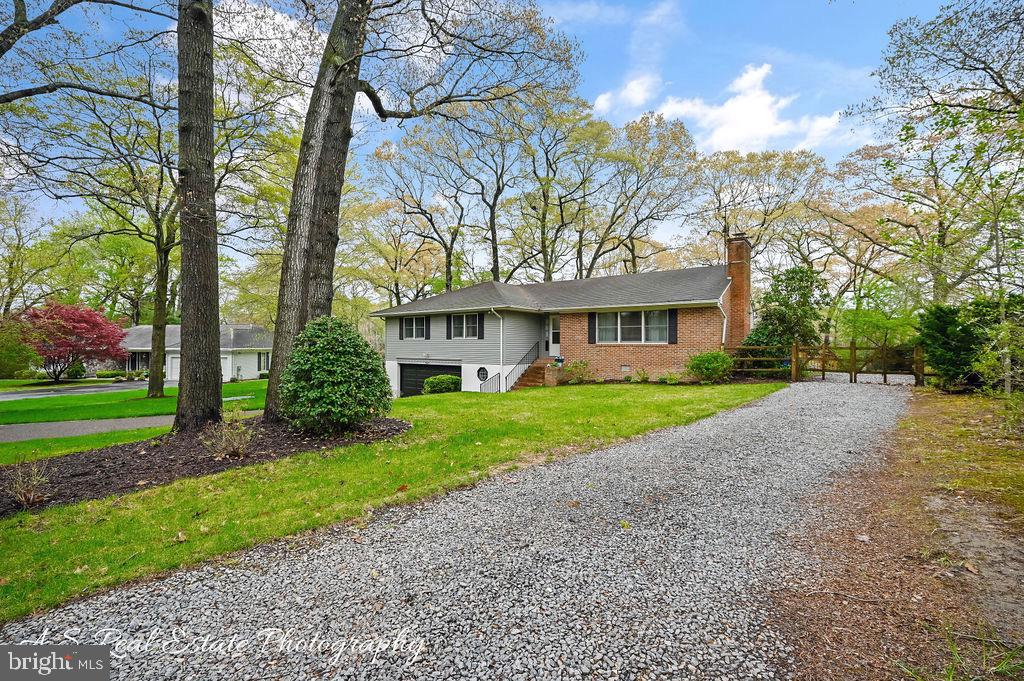 30833 Dogwood Drive Laurel, DE 19956 - Photo 23 of 27 a front view of a house with a yard and trees