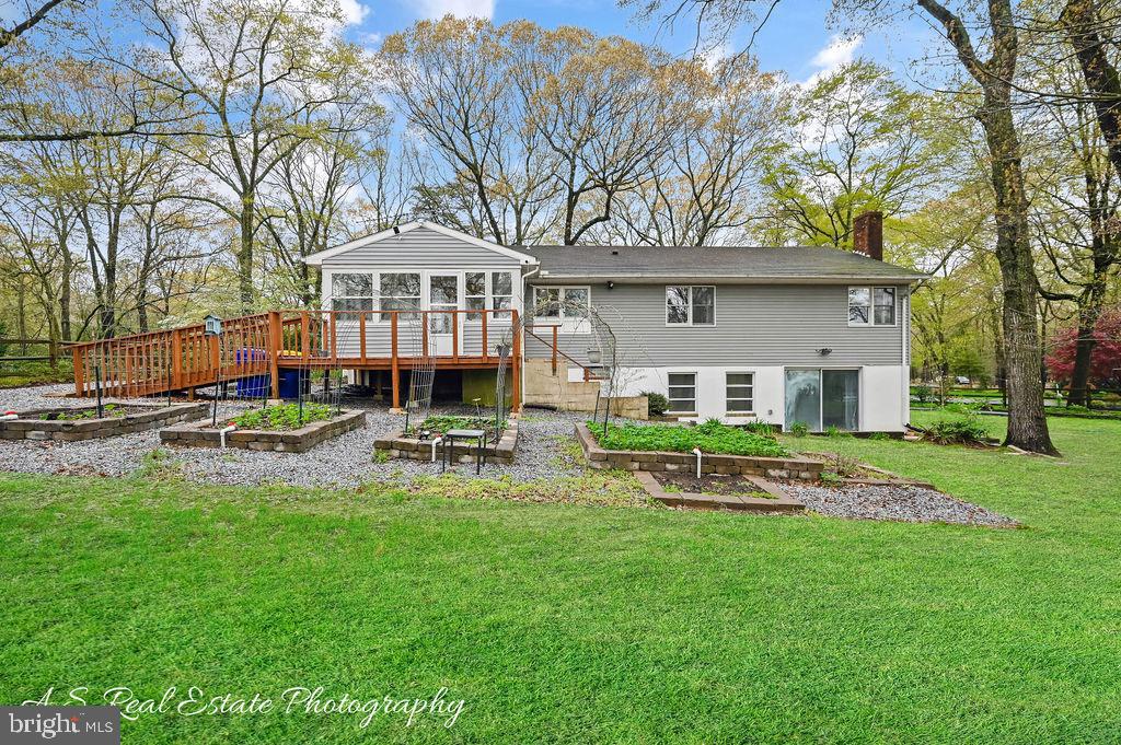 30833 Dogwood Drive Laurel, DE 19956 - Photo 7 of 27 a front view of a house with garden and trees
