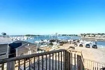 a view of a balcony with an ocean view