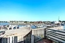 a view of a balcony with a ocean